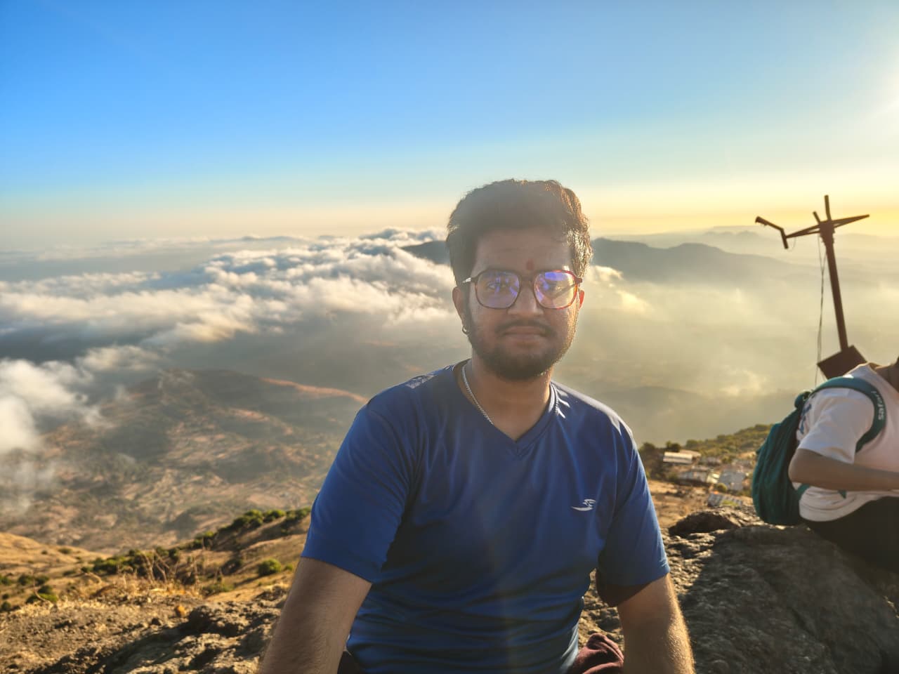 Barad on a trek with clouds below